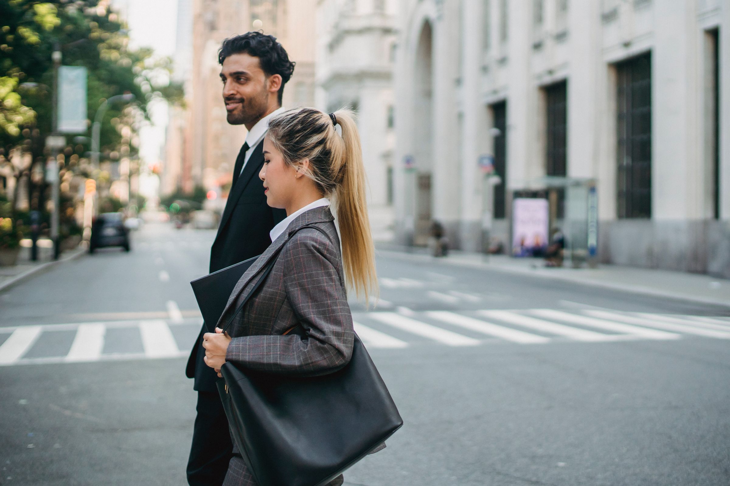 Business professionals walking together on a city street
