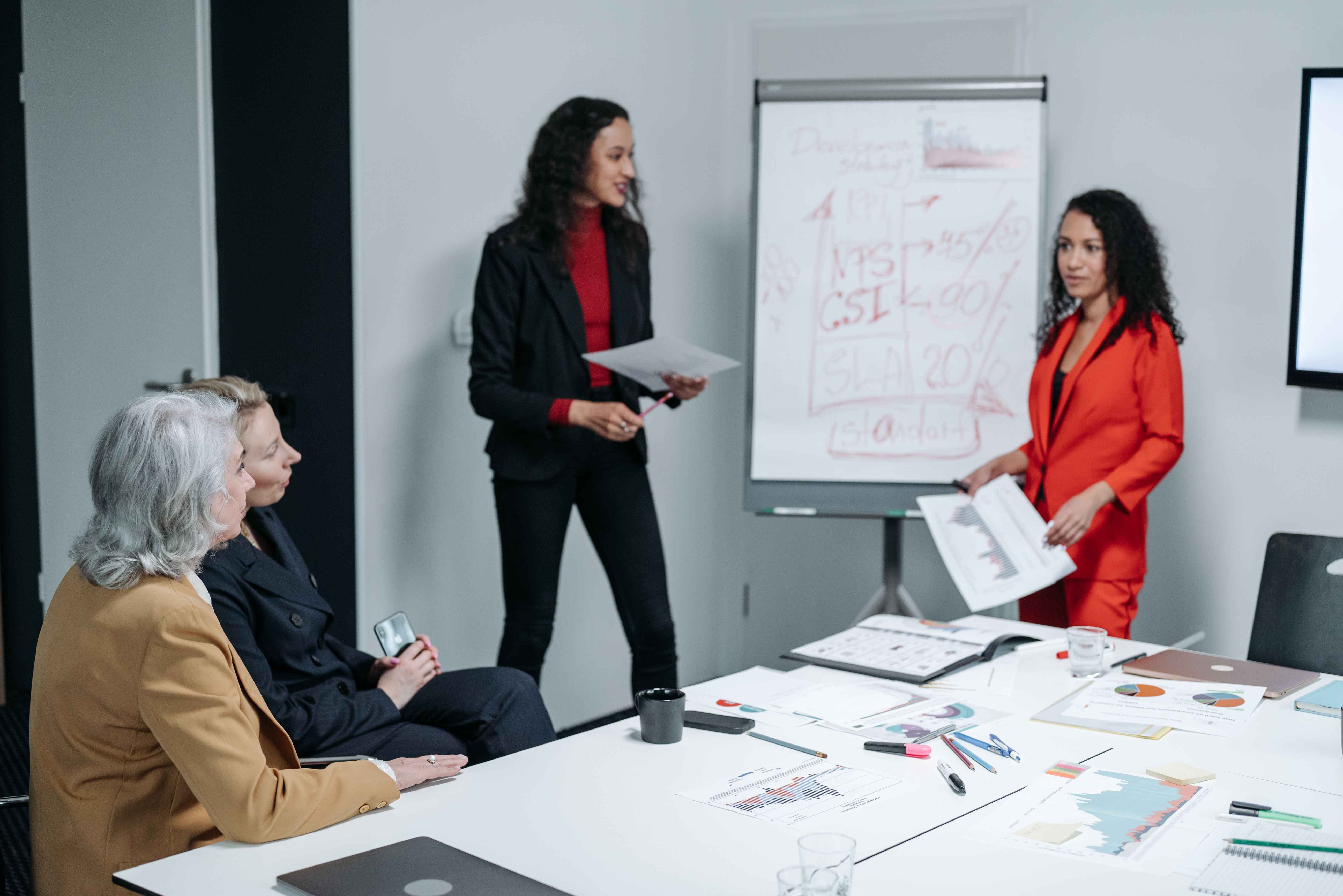 Professionals presenting financial analysis during an office training session